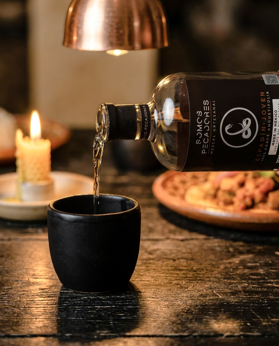 Small-batch Oaxacan mezcal — Somos Pecadores — poured into a copita at the Mextapas table